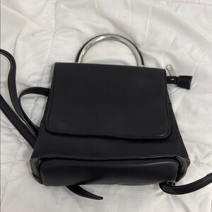 Elegant Black mini backpack. leather.